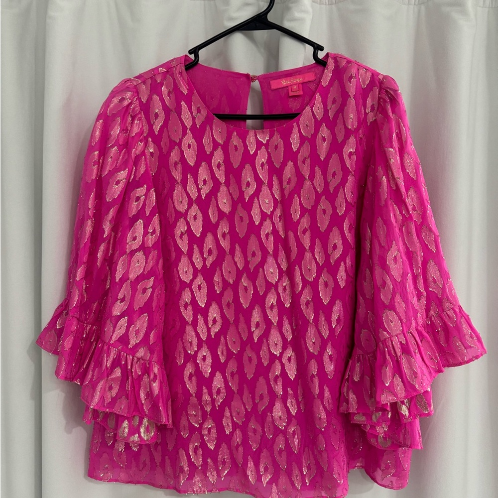 Lilly Pulitzer pink top with gold detailing.